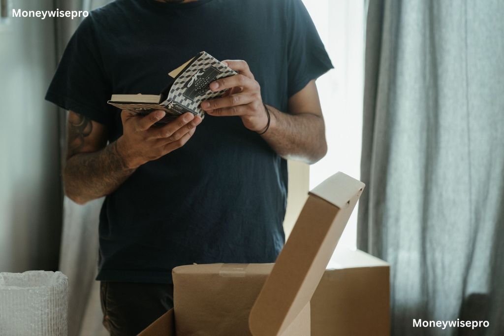  A man reading a receipt beside an opened cardboard return package