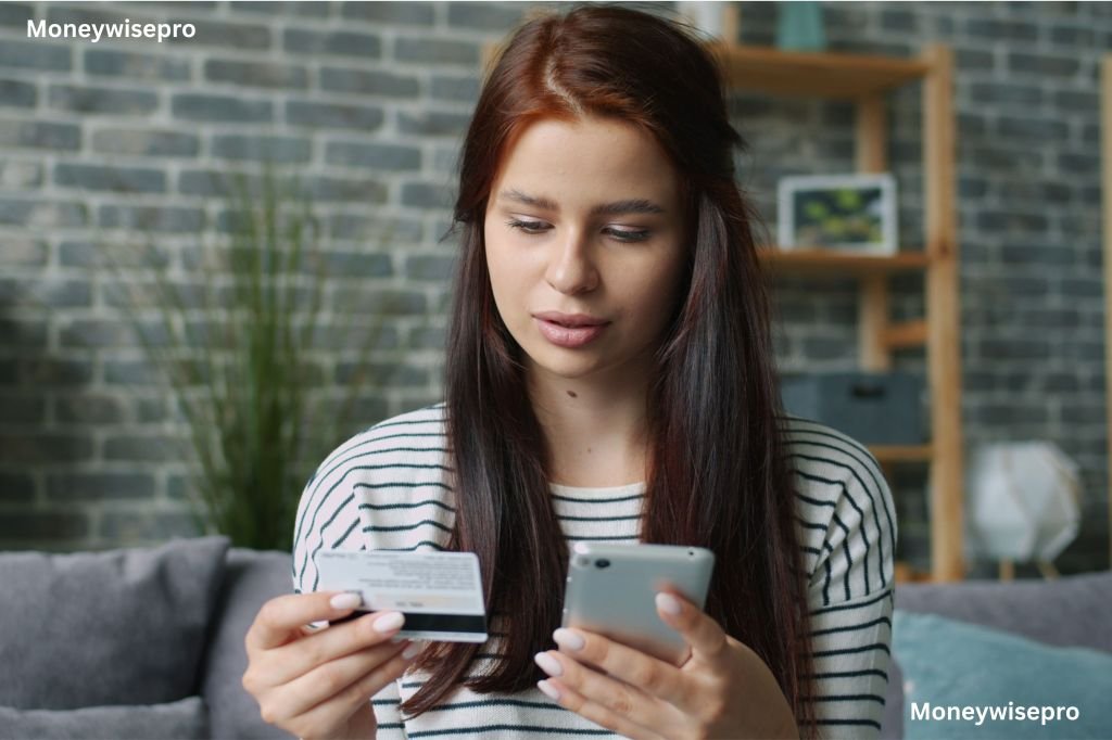 A woman checking her banking app on a smartphone while relaxing at home on a couch