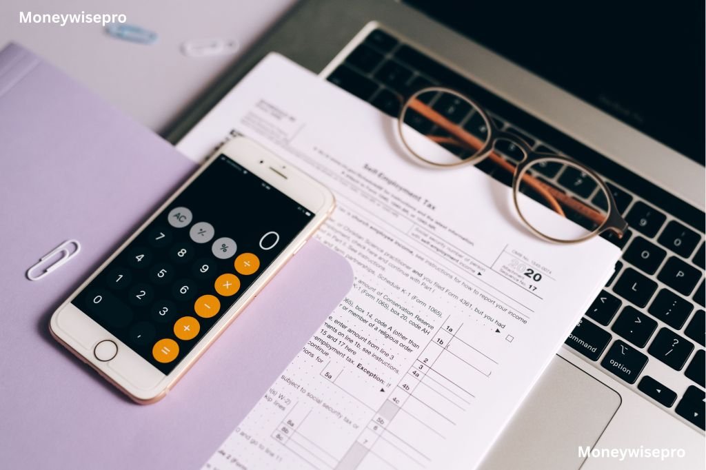 Calculator and paycheck sitting together while reviewing a state payroll deduction percentage