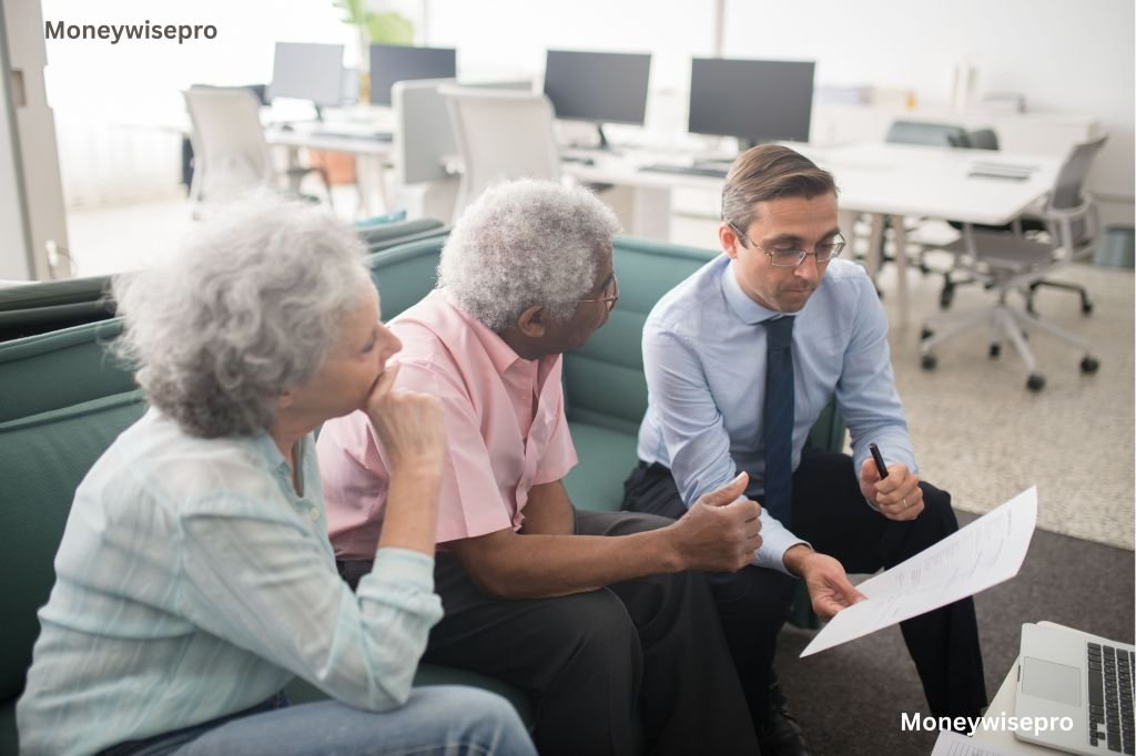 Financial advisor discussing retirement options with a client at a desk
