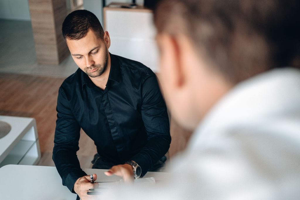 Professional conversation between employee and manager discussing compensation