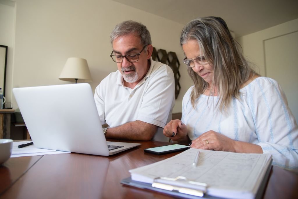 senior couple looking at retirement savings papers