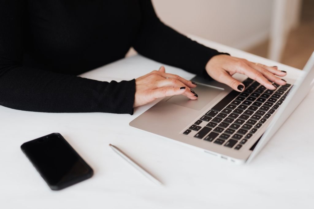 Person opening a high-yield savings account online from home