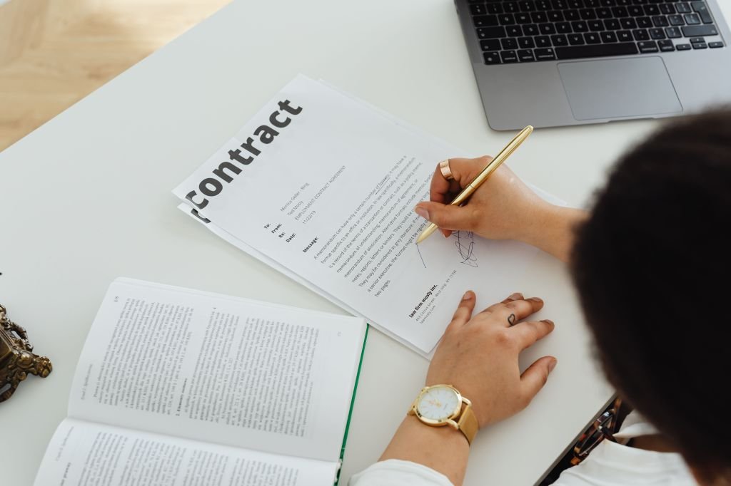 Person carefully considering financial decision before committing to loan or contract