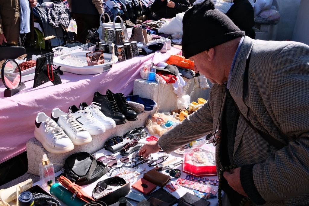 A person browsing items at a secondhand market