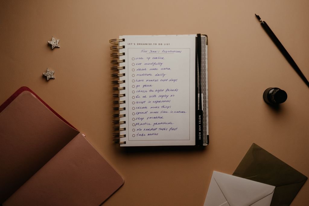 "A handwritten list in a notebook on a desk