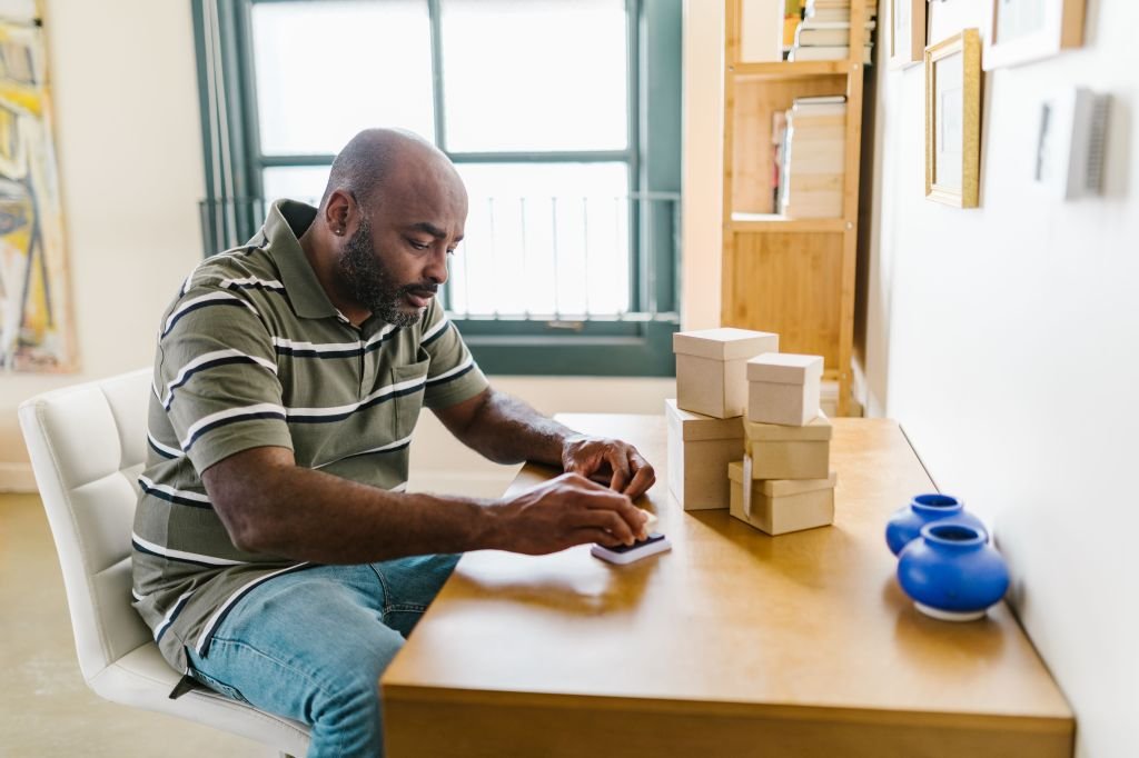 Person working on a side business from a home desk