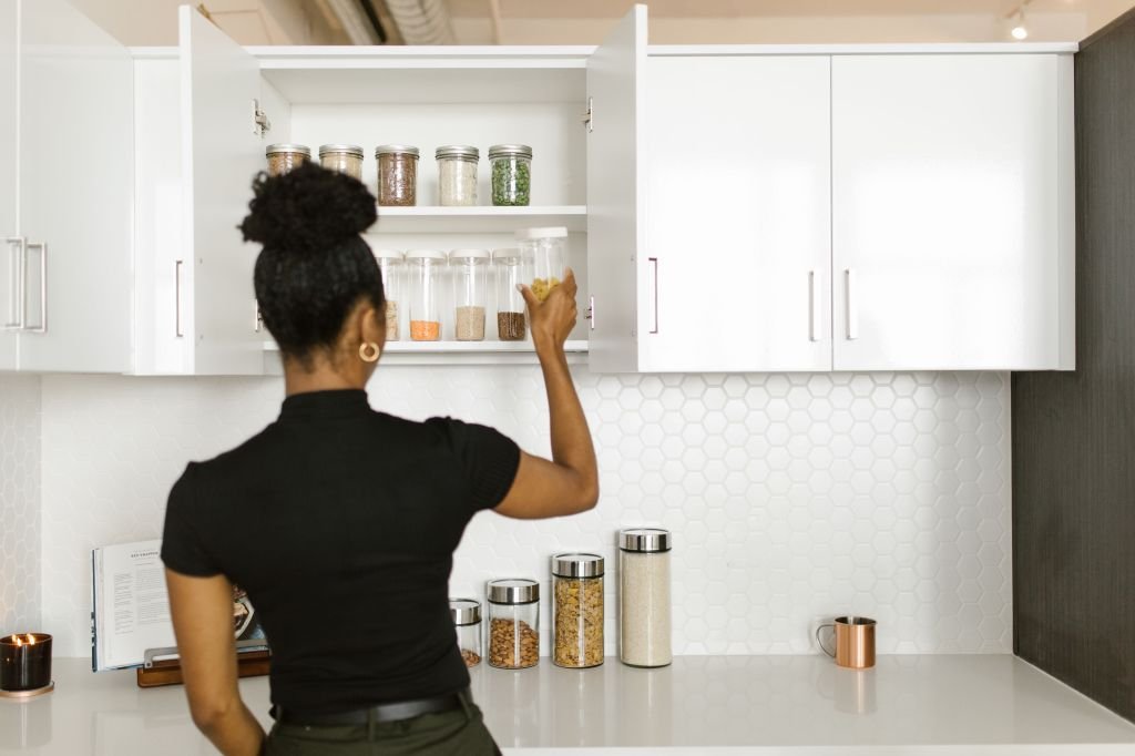 Nearly empty pantry shelves in a home kitchen