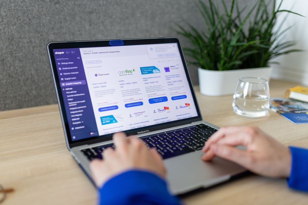 Person checking a student loan account on a laptop at home