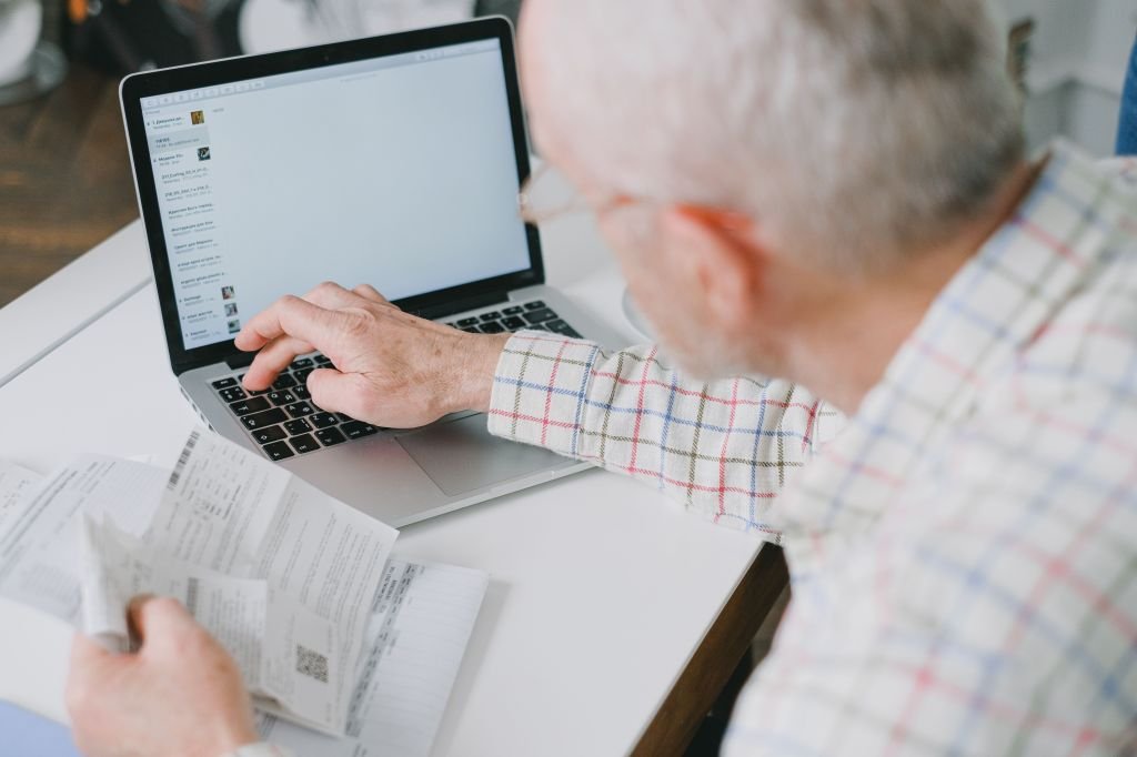 Person checking high-yield savings account on laptop