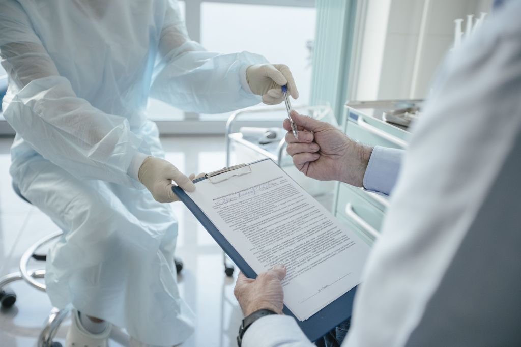 Close-up of a health insurance enrollment form being filled out