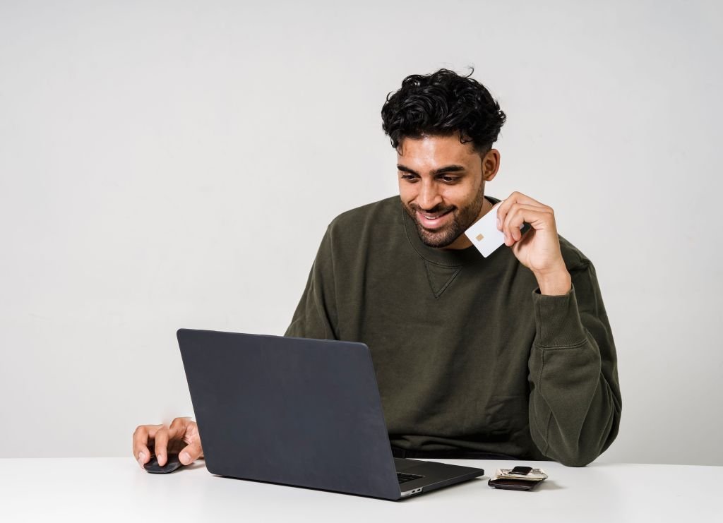 Person confidently comparing payment options or financial decisions on laptop