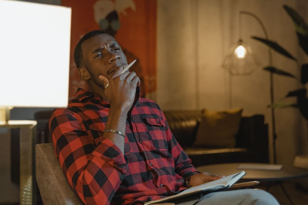 Person carefully thinking through housing budget and financial decisions